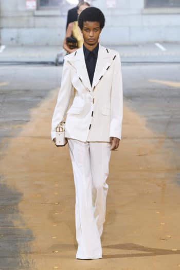 Women's white suit with gold edging at Gabriela Hearst SS23 fashion show
