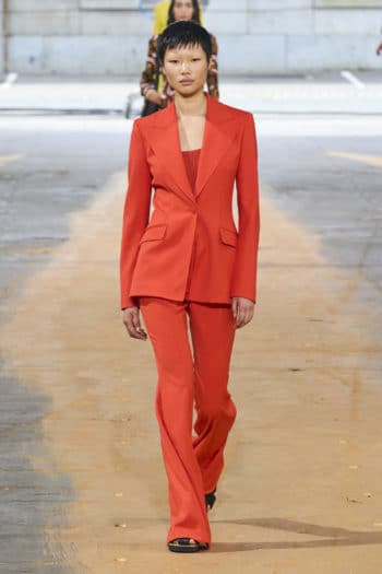 Female orange suit at Gabriela Hearst SS23 fashion week